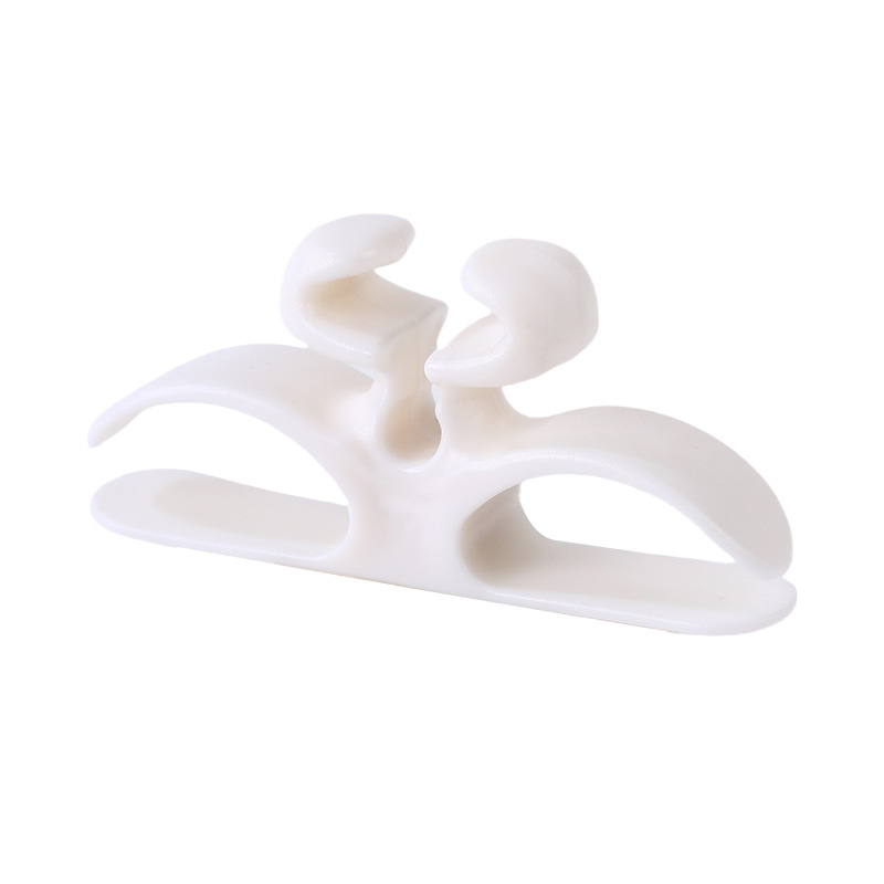 Self-adhesive silicone cable holder for home appliances