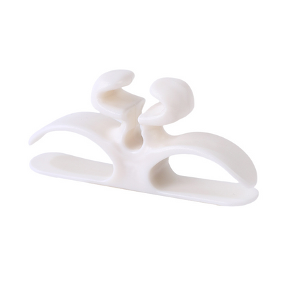 Self-adhesive silicone cable holder for home appliances